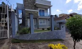 Imagem: Casa três dormitórios sendo duas suítes