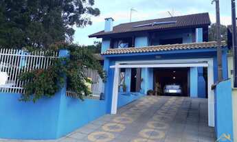 Imagem: Casa com três dormitórios sendo um uma