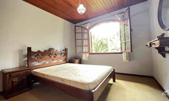 Imagem 3: Casa rústica com área gourmet e salão de jogos