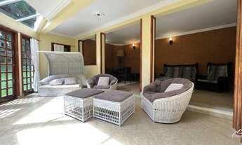 Imagem 7: Casa rústica com área gourmet e salão de jogos