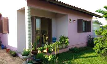 Imagem 2: Casa em alvenaria com aproximadamente 100m², com 03 dormitórios, sendo um com suíte, sala