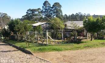Imagem: Casa de madeira em terreno de esquina de