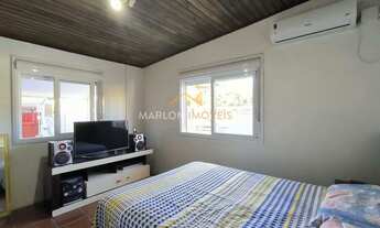 Imagem 6: Casa com 2 dormitórios, ar condicionado e garagem. Junto ao centro