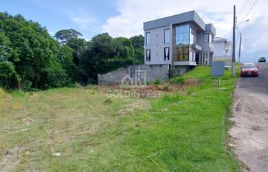 Imagem 2: ![CDATA[Terreno plano em condomínio fechado de alto padrão a 5 minutos do centro]]