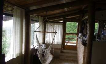 Imagem 4: Casa em condomínio AT: 6.900,00 e AC: 580,00m2, em estilo rústico. Com 03 dormitórios, sen