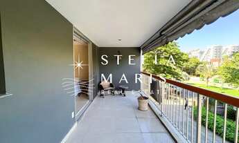 Imagem 6: Apartamento frontal com varanda e vista para copa das árvores, duas vagas de garagem em co