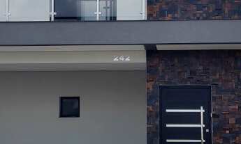 Imagem 2: Sobrado moderno com pele de vidro no Dona Lucilla