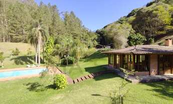 Imagem 4: Sítio à venda em Juquitiba / SP, rodeado por mata nativa em uma rua tranquila