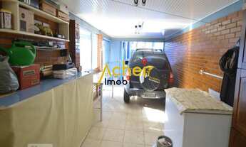 Imagem 5: Acheimob vende Casa de três dormitórios, três banheiros e quatro vagas na garagem, no bair