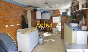 Imagem 6: Acheimob vende Casa de três dormitórios, três banheiros e quatro vagas na garagem, no bair