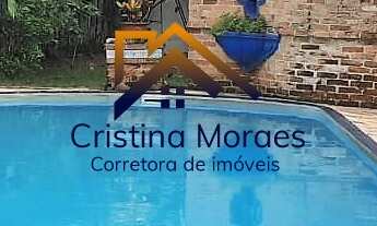 Imagem: Casa em estilo rústico, com 4 dormitórios