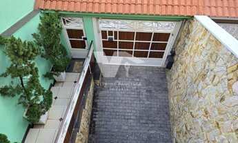 Imagem 1: Sobrado à venda na Vila Guilhermina, com 4 dormitórios, 1 suíte e 5 vagas de garagem. Poss