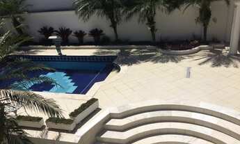 Imagem 4: 4 quartos todos suítes e 1 com closet Ar condicionado nas suítes Aquecimento solar Sala