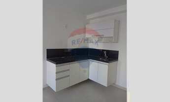 Imagem 7: Studio com planejados, box e fogão de indução