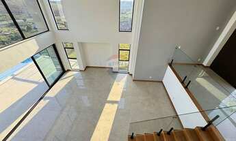 Imagem 7: Casa no Alphaville com 4 quartos sendo 4 suítes, piscina, fireplace, área gourmet, elevado