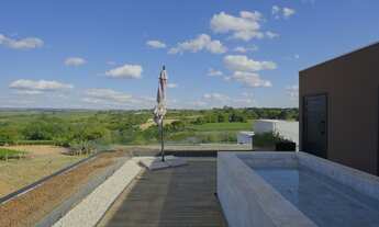 Imagem 7: Casa Moderna com projeto minimalista e quintal com jabuticabeira