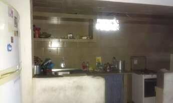 Imagem 5: Vendo terreno de fundos com casa de três andares