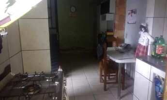 Imagem 6: Vendo terreno de fundos com casa de três andares