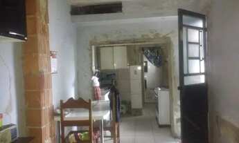 Imagem 7: Vendo terreno de fundos com casa de três andares