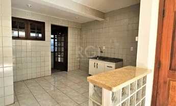 Imagem 3: Apartamento 2 dormitórios térreo com pátio, living 2 ambientes, churrasqueira, banheiro, c