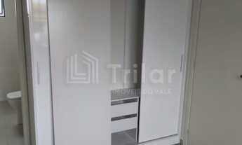 Imagem 2: Uma graça de apartamento com varanda de 1 dormitório com suíte e cozinha americana, lavabo