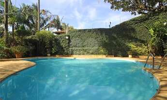 Imagem 5: Casa com muito verde e muitas flores no Jardim Guedala