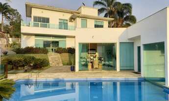 Imagem 1: Casa de condomínio térrea para venda possui 1300 metros quadrados com 4 quartos