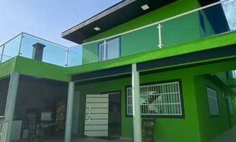 Imagem 2: Sobrado para venda possui 300 metros quadrados com 5 quartos em Caiçara - Praia Grande - S