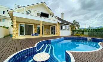 Imagem 7: Casa com 4 dormitórios sendo 3 suítes, piscina privativa e pé direito duplo. Cacupé