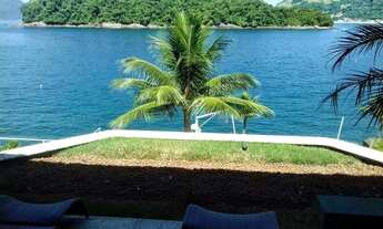 Imagem 4: Uma casa luxuosa, com 6 suítes, sala de jogos, sauna, cozinheira, deck para lancha