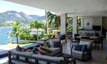 Imagem 5: Uma casa luxuosa, com 6 suítes, sala de jogos, sauna, cozinheira, deck para lancha