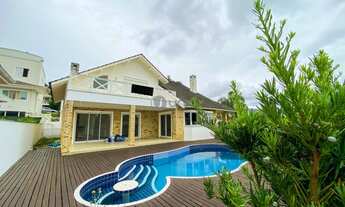 Imagem 4: Casa com 4 dormitórios sendo 3 suítes, piscina privativa e pé direito duplo. Cacupé