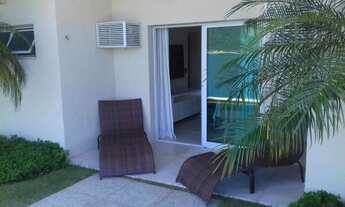 Imagem 7: Uma casa luxuosa, com 6 suítes, sala de jogos, sauna, cozinheira, deck para lancha