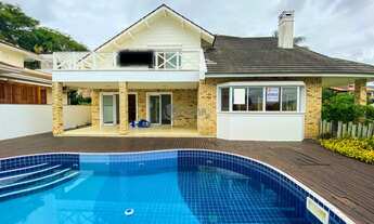 Imagem 5: Casa com 4 dormitórios sendo 3 suítes, piscina privativa e pé direito duplo. Cacupé