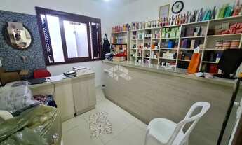 Imagem 6: Casa com 3 dormitórios (sendo 1 suíte), garagem para 2 carros, anexo nos fundos e pátio na