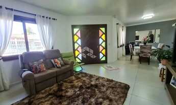 Imagem 4: Casa com 3 dormitórios (sendo 1 suíte), garagem para 2 carros, anexo nos fundos e pátio na