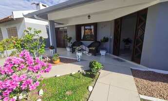 Imagem 1: Casa com 3 dormitórios (sendo 1 suíte), garagem para 2 carros, anexo nos fundos e pátio na