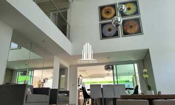 Imagem 2: 3 suítes, 5 banheiros, 3 garagens, repleta de armários, lazer completo