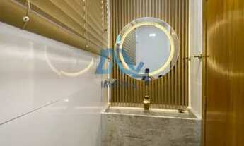 Imagem 6: Residência de Luxo: 4 Suítes, Churrasqueira e Móveis Planejados de Alto Padrão"