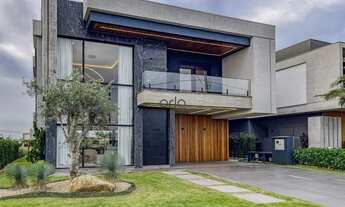 Imagem 2: Casa beira lago mobiliada e decorada com 5 suítes e piscina à venda, 417 m² - Condomínio S