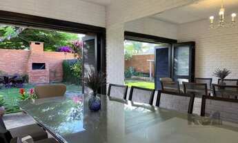 Imagem 6: Casa avulsa em Atlântida, totalmente reformada, com 5 dormitórios , duas suítes, pátio arb