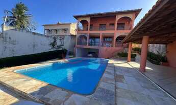 Imagem: Ampla casa triplex com vista para o mar