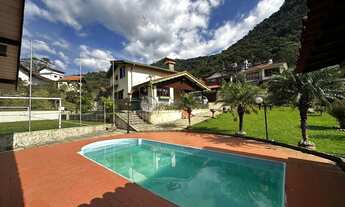 Imagem 2: Casa à venda com 4 quartos sendo 2 suítes, 1.245 m² de terreno em condomínio no Comary - T