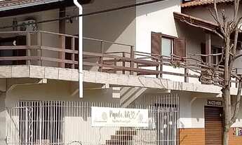 Imagem 2: Sobrado com ampla residencia e no térreo 6 lojas gerando renda