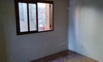 Imagem 6: Casa com dois quartos, garagem, pátio e churrasqueira