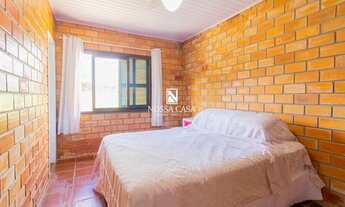 Imagem 6: Casa para venda possui 200 metros quadrados com 5 quartos em Praia da Cal - Torres - RS