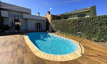 Imagem 7: Casa Maria Luiza com piscina aquecida, imóvel semi-mobiliado