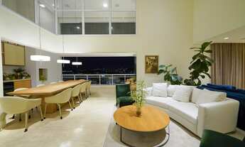 Imagem 5: Apartamento moderno com pé-direito duplo no living e varanda e vista para a cidade