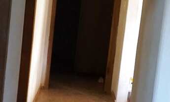 Imagem 2: Casa com um predinho nos fundos