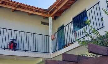 Imagem 6: Casa com um predinho nos fundos